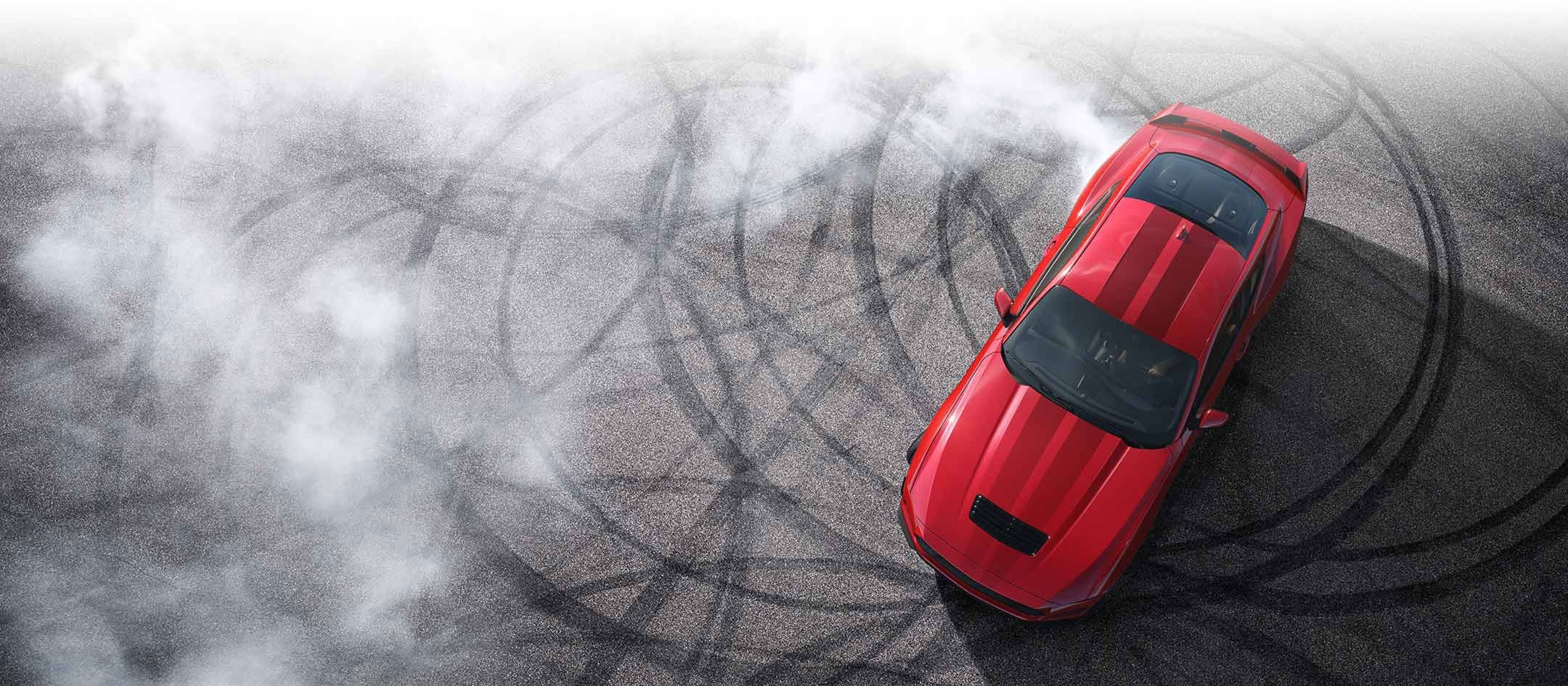 Overhead view of a 2024 Ford Mustang® model with tire tracks on pavement | Sawgrass Ford in Sunrise FL